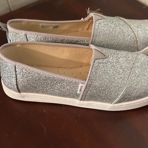 TOMS Shimmering Silver Slip-Ons - Picture 3 of 3